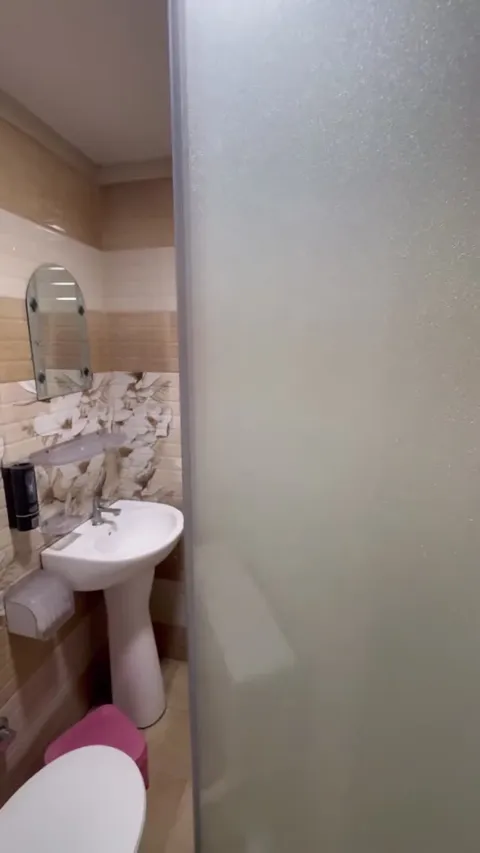 Bathroom with washbasin shown in the Hotel Max room tour